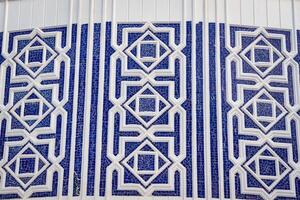 Geometric traditional Islamic ornament. Fragment of a ceramic mosaic. photo