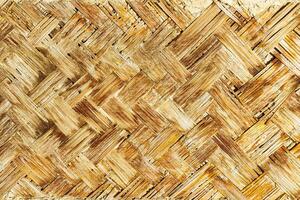 The texture of the frame of an oriental building made of woven bamboo. Abstract background. photo