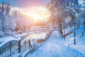 Sunset or dawn on a canal with non-freezing water on a cold winter day. photo