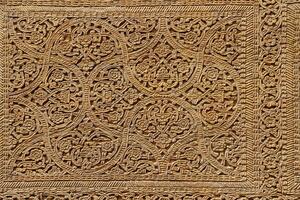 Fragment of an ancient carved wooden door. Ornate. photo