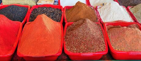 Multi-colored oriental spices on the counter of the bazaar. photo