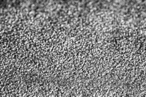 Monochrome texture of shiny grained metal. Abstract background. photo