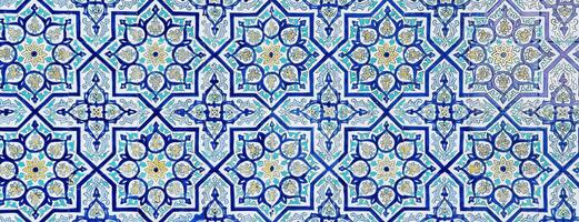 Geometric traditional Islamic ornament. Fragment of a ceramic mosaic. photo