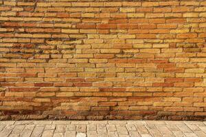 Old antique red brick wall and pavement texture. photo