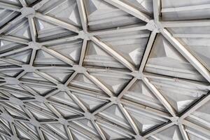 The steel inner part of the roof with the framework of the Chorsu Bazaar in Tashkent. Geometric architectural background. photo