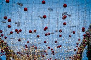 New Year or Christmas festive balls and garlands hanging in rows. photo