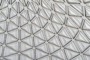 The steel inner part of the roof with the framework of the Chorsu Bazaar in Tashkent. Geometric architectural background. photo