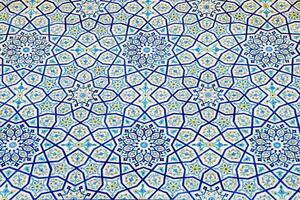 Geometric traditional Islamic ornament. Fragment of a ceramic mosaic. photo