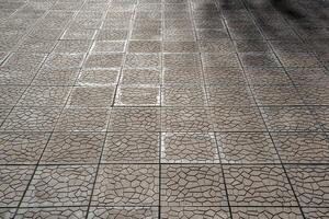 The texture of a tiled pavement with perspective. photo
