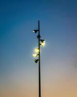 Lighting Modern LED lantern against the twilight sky. photo