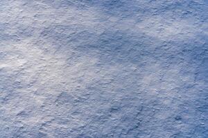 Texture of snow illuminated by sunlight. photo