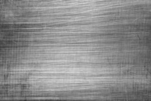 Monochrome texture of shiny scratched metal. Abstract background. photo