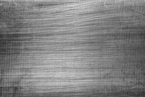 Monochrome texture of shiny scratched metal. Abstract background. photo