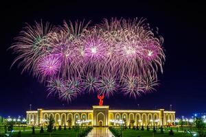 Uzbekistan, Tashkent - September 1, 2023 Multi-colored fireworks over the Independence Monument in Yangi Uzbekistan Park in Tashkent on Independence Day. photo