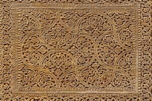 Fragment of an ancient carved wooden door. Ornate. photo