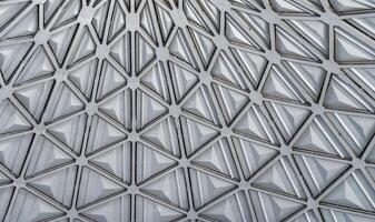 The steel inner part of the roof with the framework of the Chorsu Bazaar in Tashkent. Geometric architectural background. photo