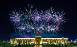 Uzbekistan, Tashkent - September 1, 2023 Multi-colored fireworks over the Independence Monument in Yangi Uzbekistan Park in Tashkent on Independence Day. photo