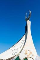 UZBEKISTAN, TASHKENT - SEPTEMBER 15, 2023 Monument of Independence in the form of a stele with a Humo bird on a daytime in the New Uzbekistan park in summer. photo