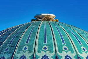 The roof of the Chorsu Bazaar in Tashkent against the blue sky. photo