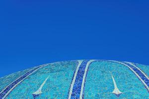 The roof of the Chorsu Bazaar in Tashkent against the blue sky. photo