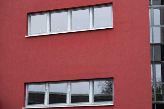 office building with red walls and windows photo