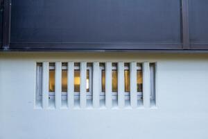 light behind modern window in concrete wall photo