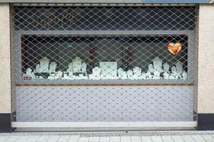 barred shop window of a jewelry store photo