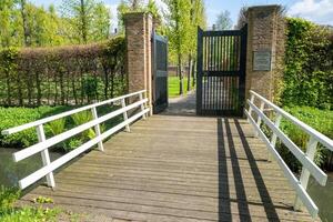 wide pedestrian bridge over canal photo