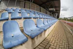 blue seats in a sports stadium photo