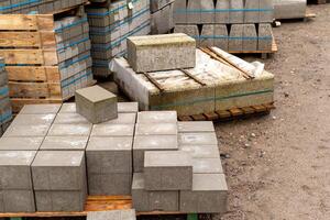 a lot of paving stones for road construction photo