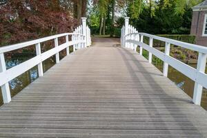 wide pedestrian bridge over canal photo