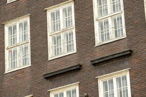 old brick building with old double windows photo