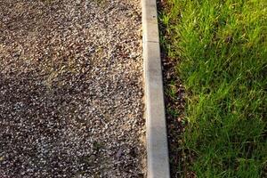 View from above Gravel path, curb, grass photo