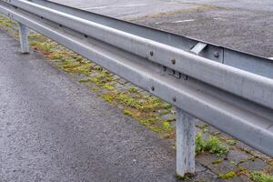 guardrail divides the road photo