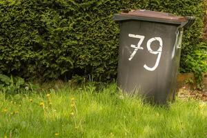 garbage can with the number 79 photo