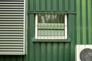 old office building with windows and air conditioning photo