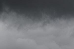 Cloudscape scenery, overcast weather above dark blue sky. Storm clouds floating in a rainy dull day with natural light. White and grey scenic environment background. Nature view. photo