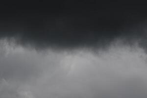 Cloudscape scenery, overcast weather above dark blue sky. Storm clouds floating in a rainy dull day with natural light. White and grey scenic environment background. Nature view. photo