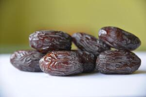 Close-up of organic gourmet Medjool date fruit at the market. View from above. photo