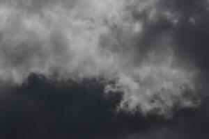 Cloudscape scenery, overcast weather above dark blue sky. Storm clouds floating in a rainy dull day with natural light. White and grey scenic environment background. Nature view. photo