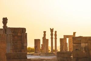 Persepolis, Iran - 8th june, 2022 - Beautiful Sunrise in Persepolis, capital of the ancient Achaemenid kingdom. Ancient sites columns. Ancient Persia.Famous travel destination photo