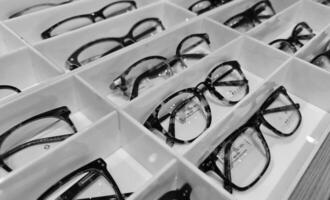 Bekasi, Indonesia on December 12 2023. Several glasses are neatly arranged in an glasses shop window. photo