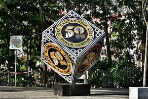 Kuala Lumpur, Malaysia on May 21 2023. A cube-shaped monument to commemorate Dirgahayu Bandar Raya Kuala Lumpur 1972 - 2022. Located in city center photo