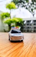 Close up bokeh photo of a boy's toy police car.