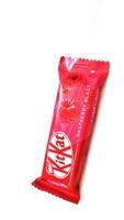 Medina, Saudi Arabia on February 29 2024. 2 finger KitKat chocolate with raspberry blast flavor, with Arabic writing. A signature crispy wafer center, balanced with smooth milk chocolate, raspberry. photo