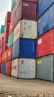 Jakarta, Indonesia on December 6, 2023. Stacks of colorful containers at a logistics warehouse in Cakung. photo