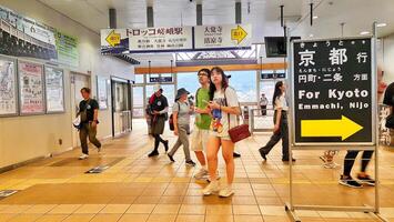 Kyoto, Japan on 1 October 2023. Tourists are walking at the Saga Arashiyama Train station photo
