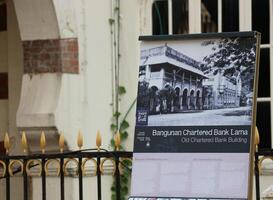 Kuala Lumpur, Malaysia on May 22 2023. Information board from the Old Chartered Bank Building photo