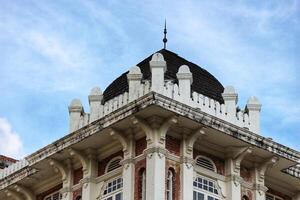 Kuala Lumpur, Malaysia on May 21, 2023. The top of the building and roof of the former chartered bank building photo