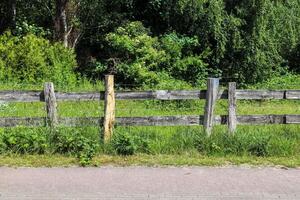 Beautiful wooden horse fence at an agricultural field photo